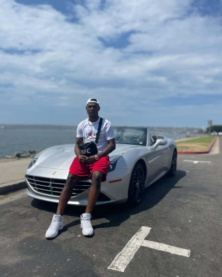 Jamahal Hill Sitting On Hood Of Ferrari Wallpaper