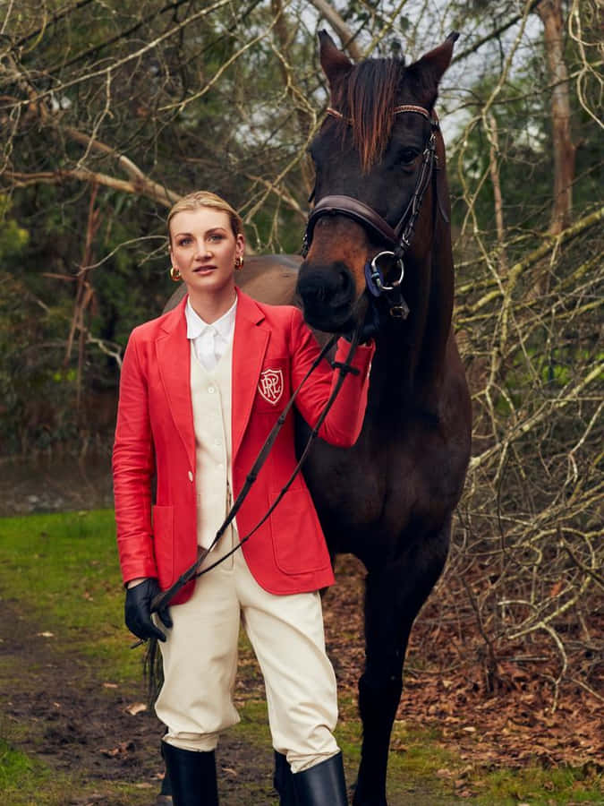 Jamie Kah Posing With A Winning Horse Wallpaper