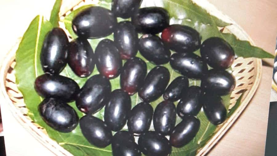 Java Plums Inside Weave Basket Wallpaper