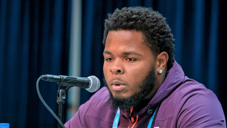 Jawaan Taylor In Action On The Football Field Wallpaper