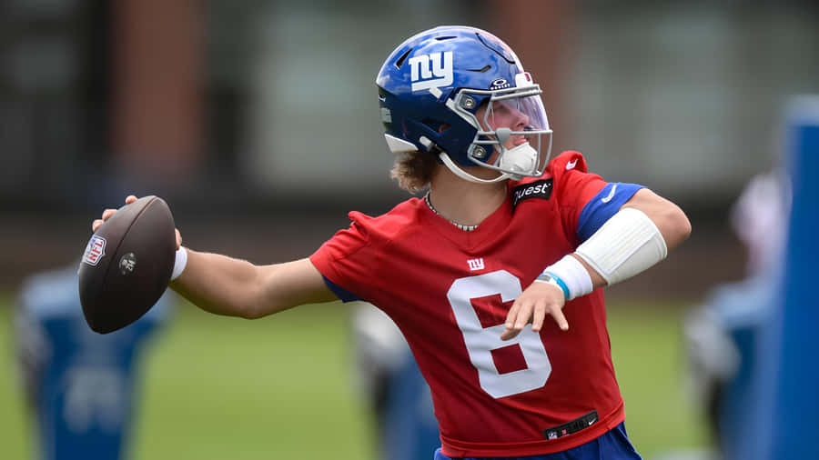 Jaxson Dart Throwing Football Wallpaper