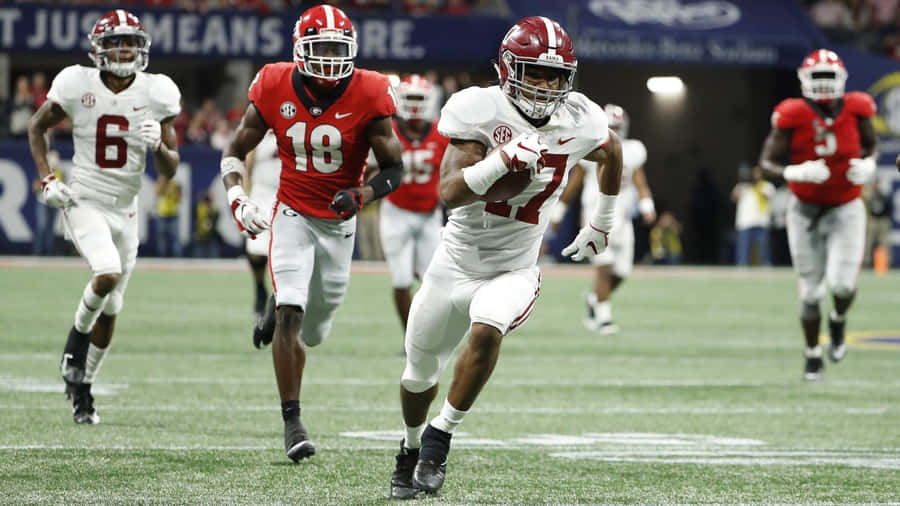 Jaylen Waddle In Action During College Football Game Wallpaper