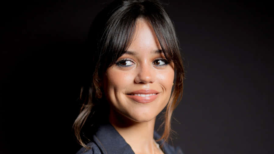 Jenna Ortega Smiling Portrait Wallpaper