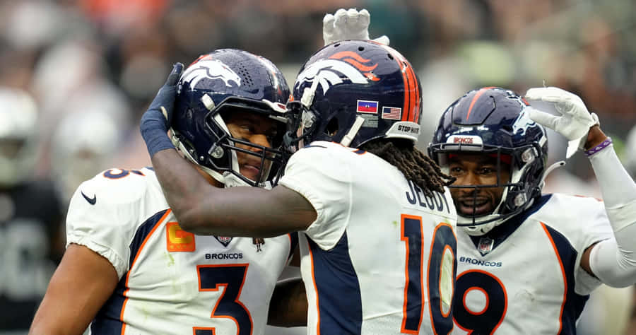Jerry Jeudy Celebrationwith Denver Broncos Teammates Wallpaper