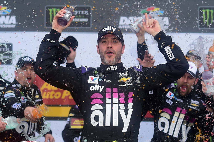 Jimmie Johnson Racing During A Nascar Event Wallpaper