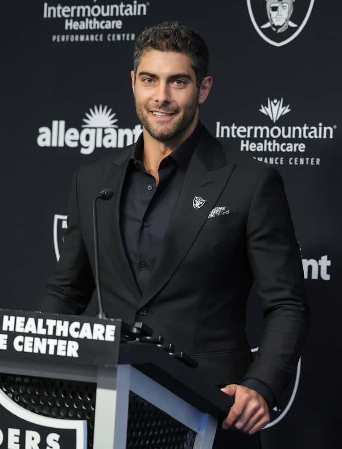 Jimmy Garoppolo In Action During A Football Game Wallpaper