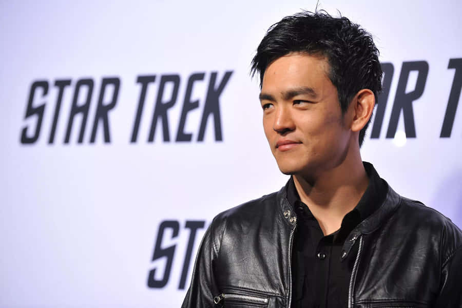John Cho, Acclaimed Actor, Posing During A Photoshoot Wallpaper