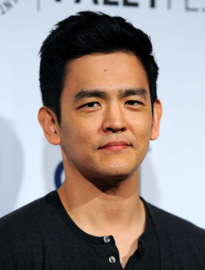 John Cho Poses Confidently During A Photo Shoot Wallpaper