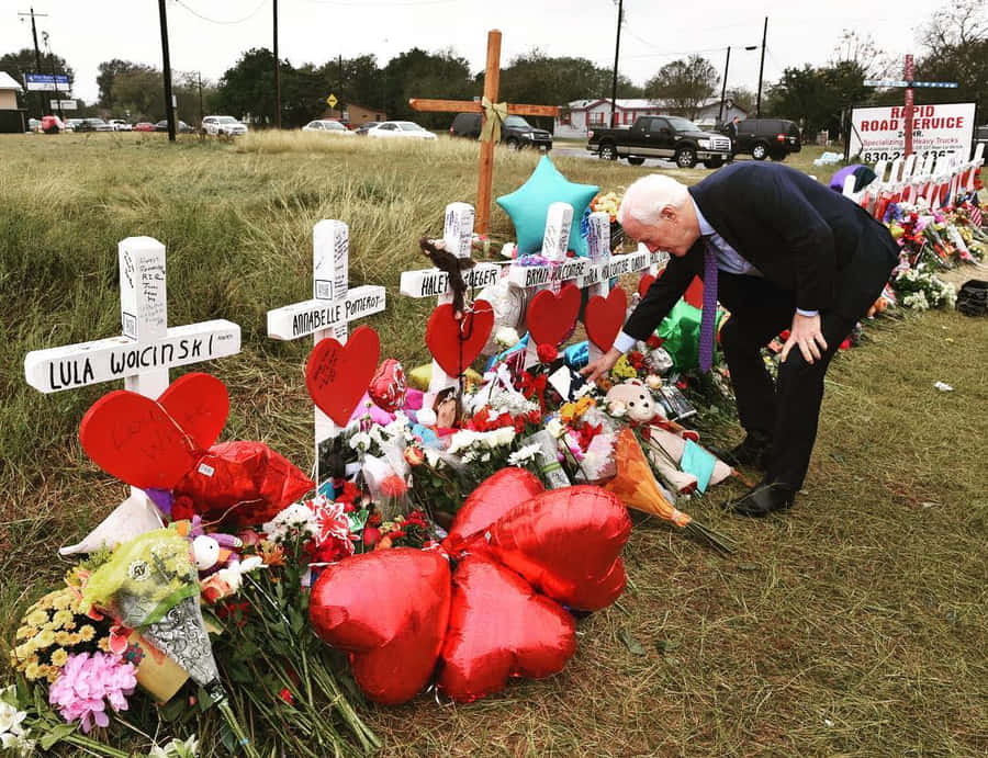 John Cornyn Visiting A Cemetery Wallpaper