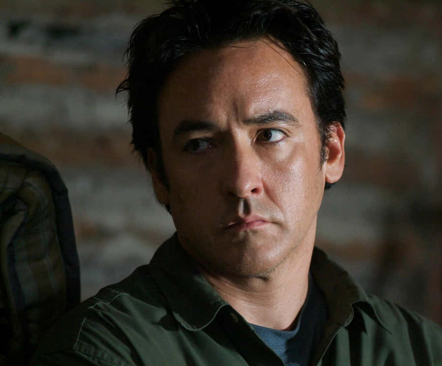 John Cusack In A Contemplative Pose Wallpaper