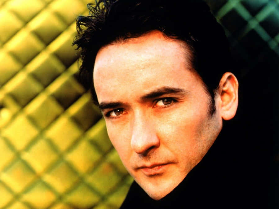 John Cusack Smiling Wearing A Suit Wallpaper