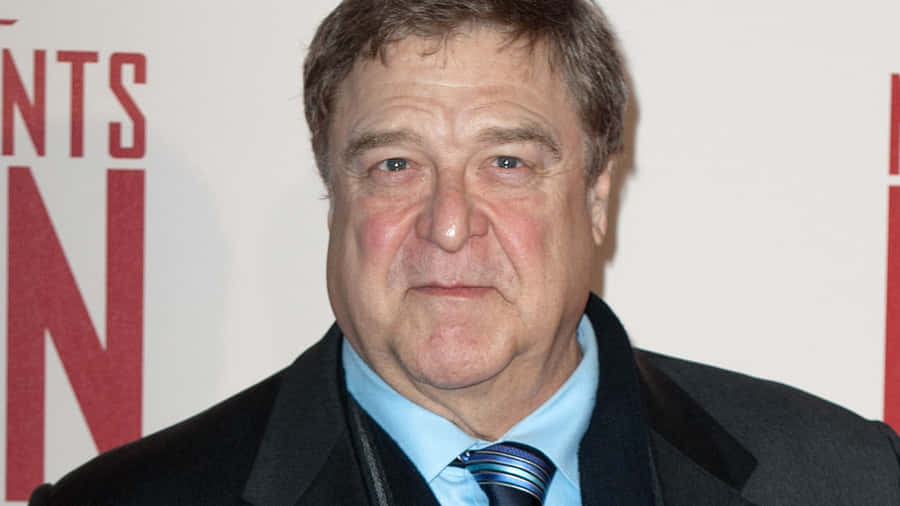 John Goodman Smiling At A Red Carpet Event. Wallpaper