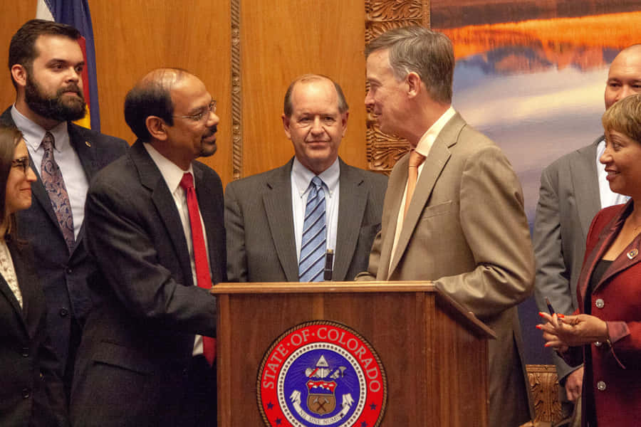 John Hickenlooper Delivering A Speech Wallpaper