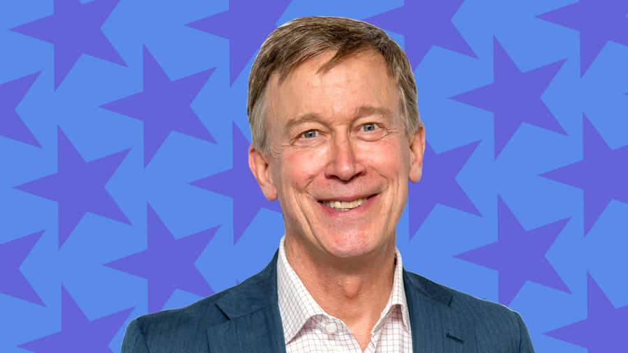 John Hickenlooper With Blue Stars Backdrop Wallpaper