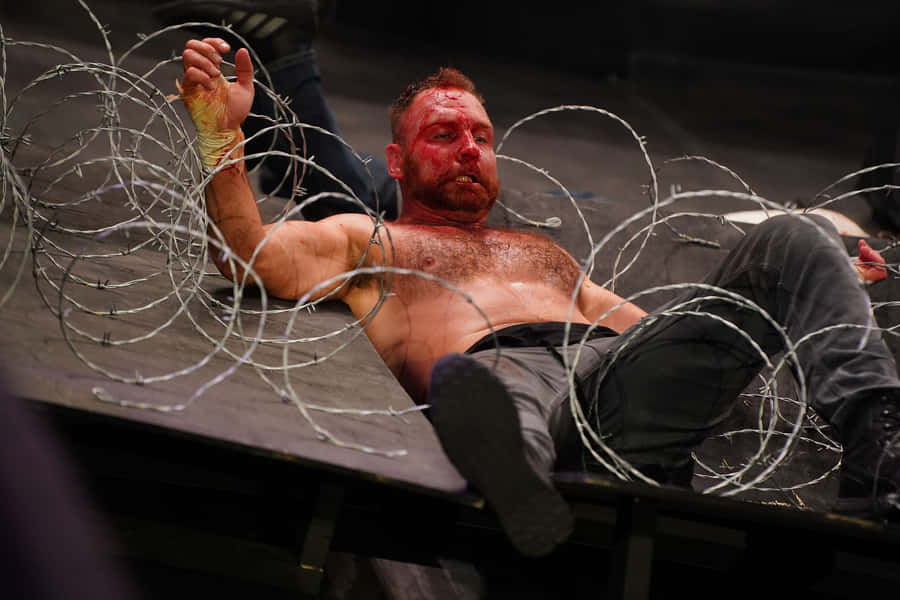 Jon Moxley Displaying His Intense Wrestling Fury Wallpaper