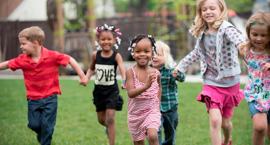 Joyful Children Playing Outdoors Wallpaper