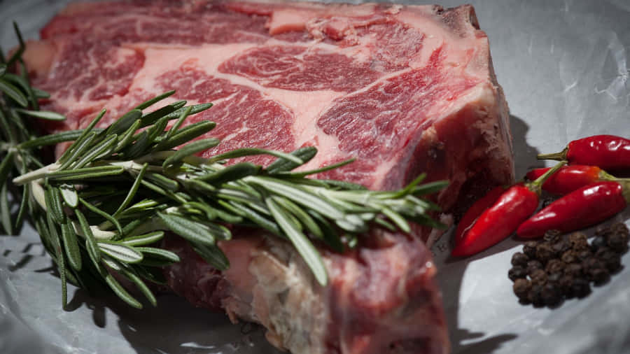 Juicy Red Meat On A Cutting Board Wallpaper