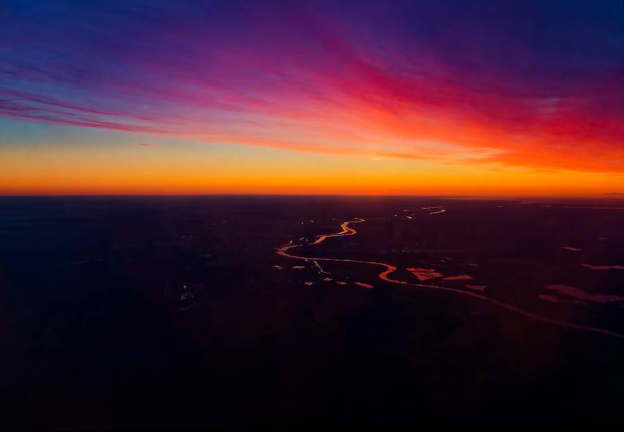 Kaleidoscopic Sunset Sky In Riga Wallpaper