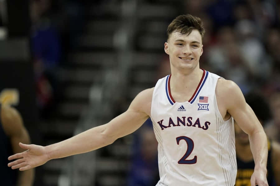 Kansas Basketball Player Christian Braun Celebrating Wallpaper