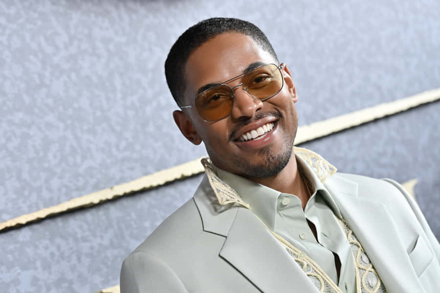 Kelvin Harrison Jr Smilingin Designer Suit Wallpaper