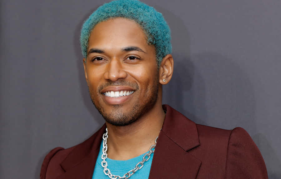 Kelvin Harrison Jr Smilingwith Teal Hair Wallpaper
