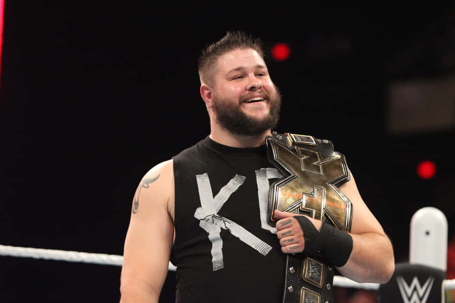 Kevin Owens Smiling Champion Wallpaper