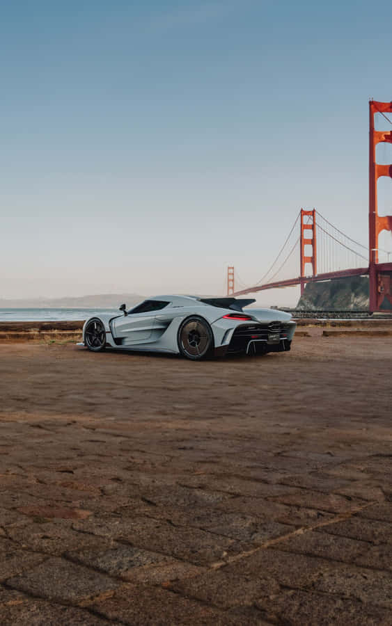 Koenigsegg Jesko Beside Golden Gate Bridge Wallpaper