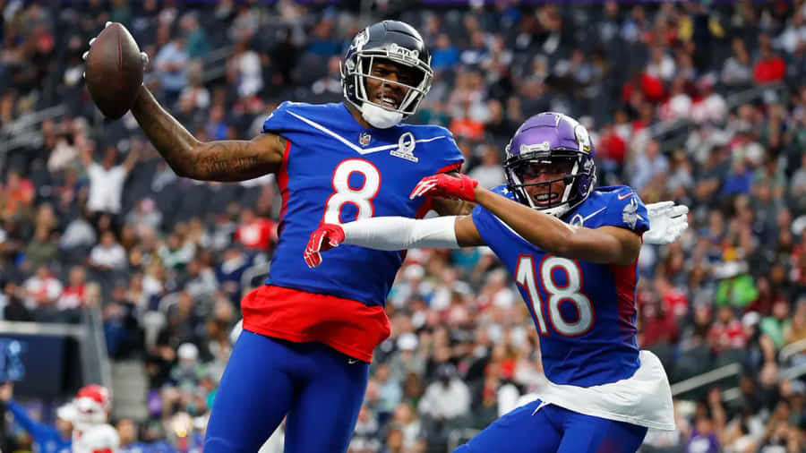 Kyle Pitts Catching Football During Game Wallpaper