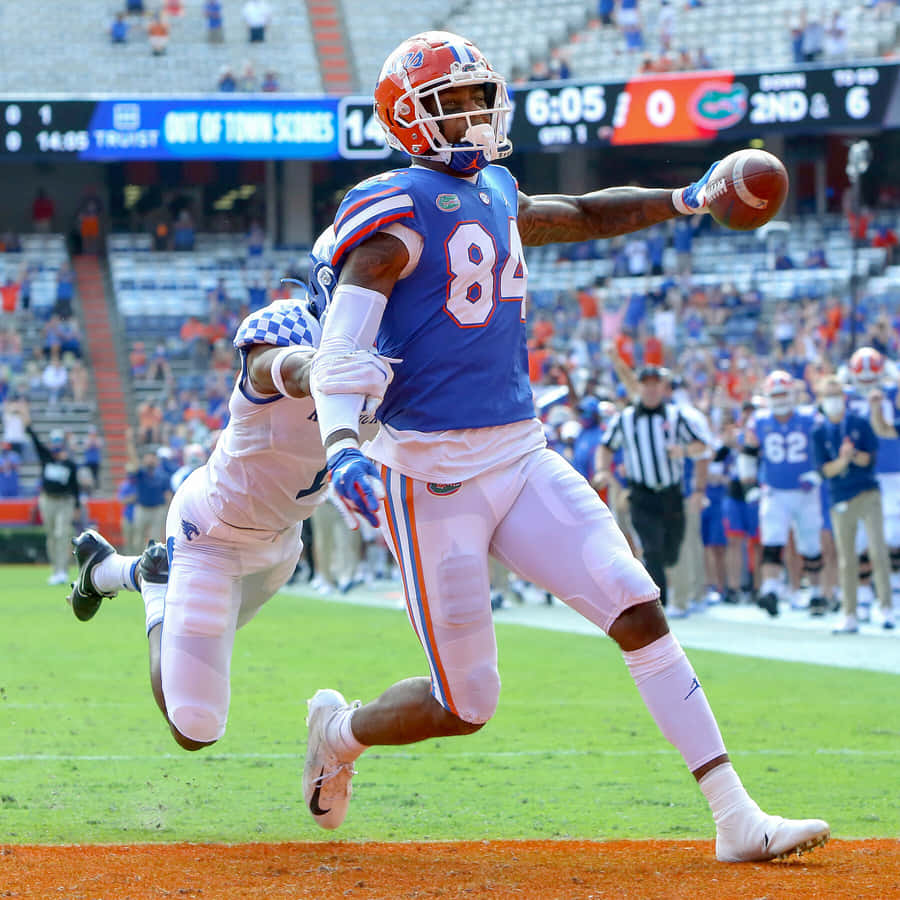 Kyle Pitts Catching Football Game Wallpaper