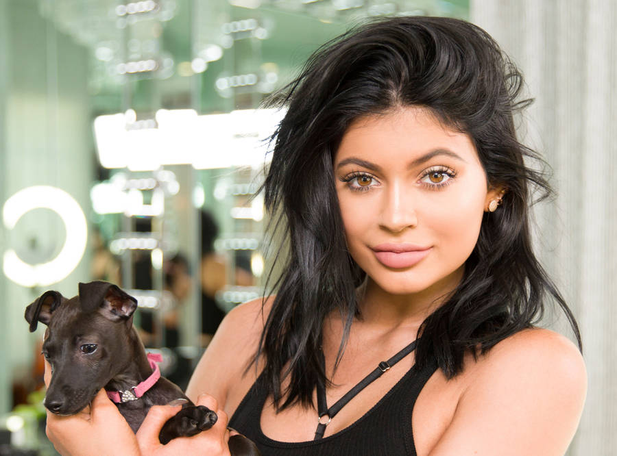 Kylie Jenner Holding Her Dog Wallpaper