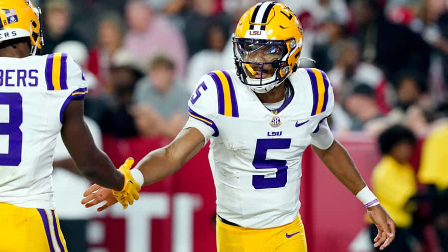 L S U Quarterback Handshake Celebration Wallpaper