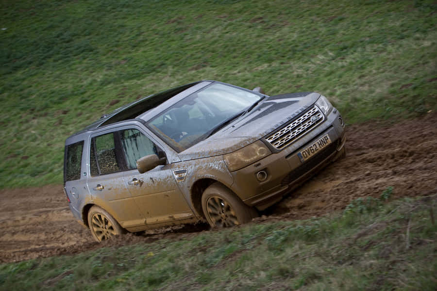 Land Rover Freelander Conquering Off-road Terrain Wallpaper