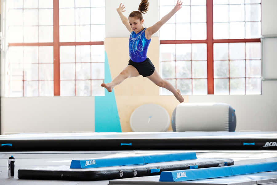 Learn And Practice Gymnastics With The Right Mat. Wallpaper