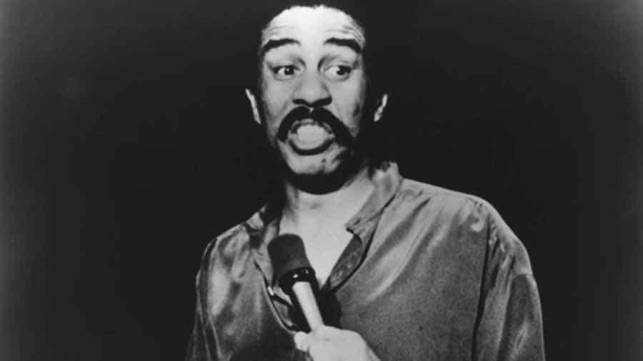 Legendary Comedian Richard Pryor In Performance Wallpaper