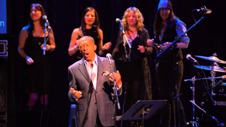 Legendary Singer Performance On Stage Wallpaper