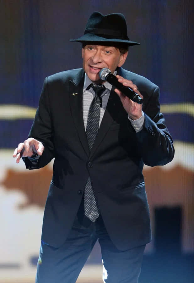 Legendary Singer-songwriter Bobby Caldwell In A Live Performance Wallpaper