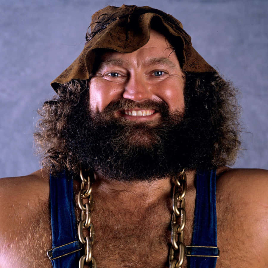 Legendary Wrestler Hillbilly Jim Smiling Portrait Wallpaper