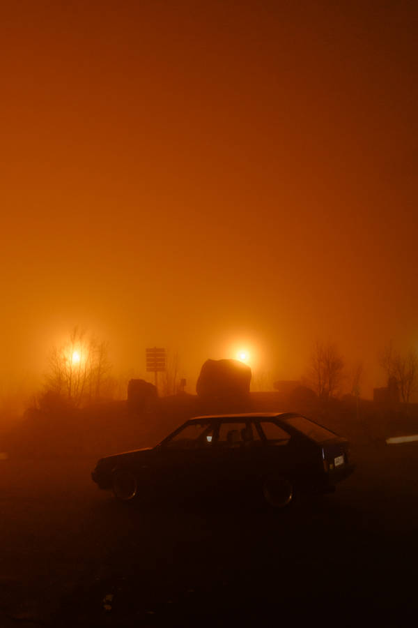 Light Brown Sunset Car On Road Wallpaper