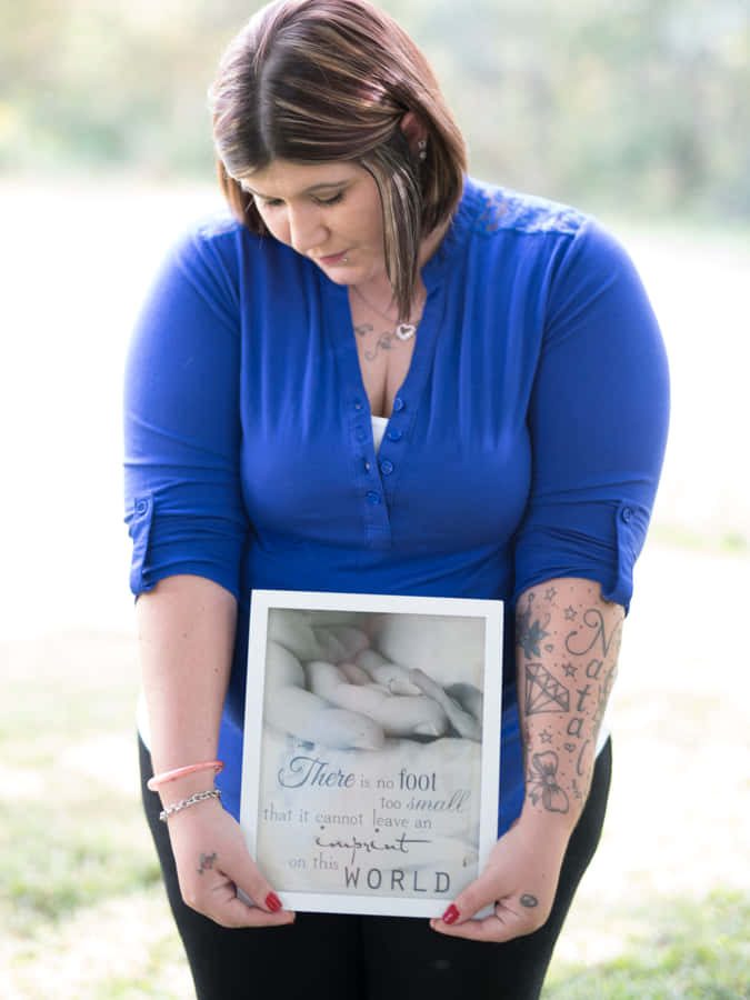 Lighting A Candle In Remembrance Wallpaper