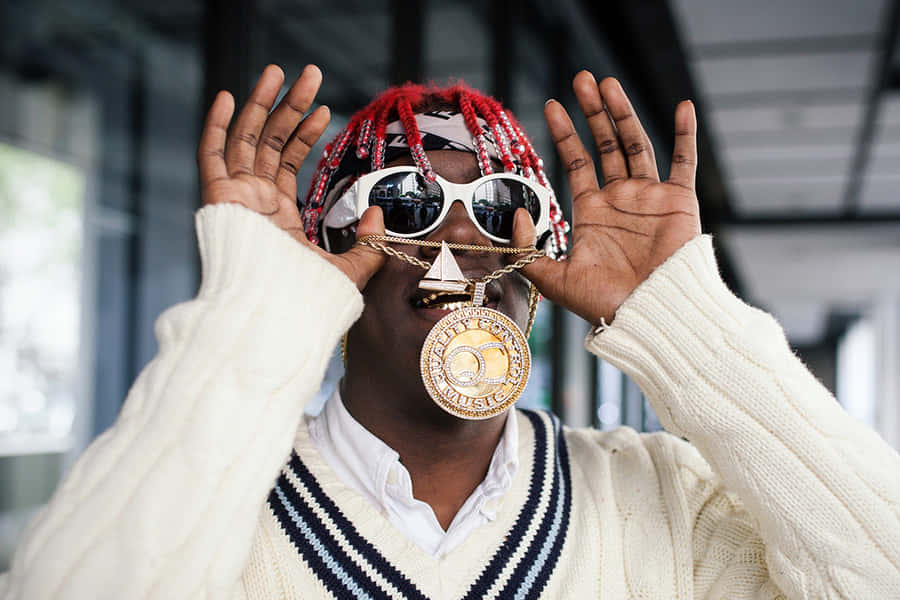 Lil Yachty Confidently Showing Off His Iconic Hairstyle Wallpaper