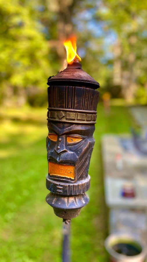 Lit Tiki Torch Garden Decor Wallpaper