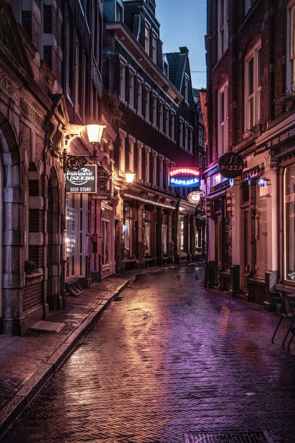 Local Pub On A Street At Night Wallpaper