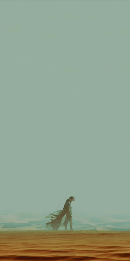 Lone_ Figure_ Walking_ Across_ Dune_ Desert Wallpaper
