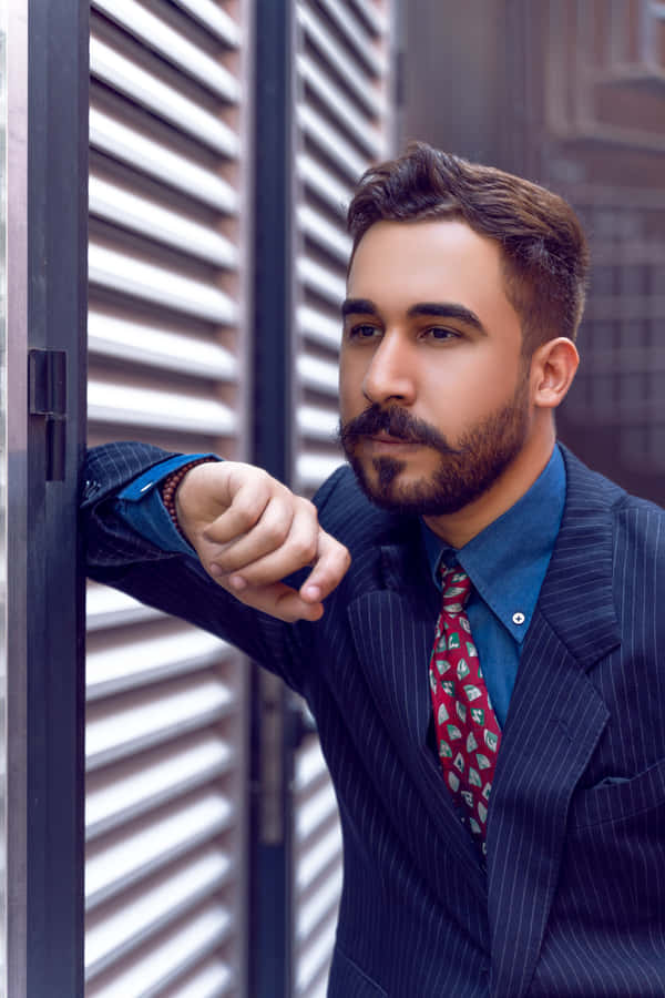 Look Stylish And Professional With A Navy Blue Blazer Wallpaper