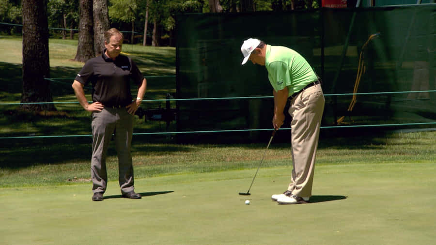 Loren Roberts Giving Putting Stroke Advice Wallpaper