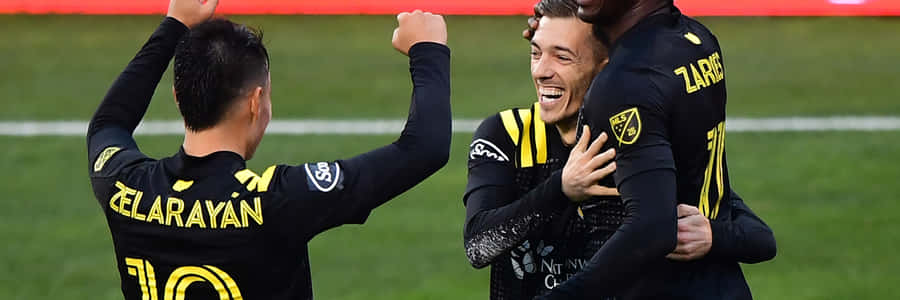 Lucas Zelarayan Celebrating With Teammates Wallpaper