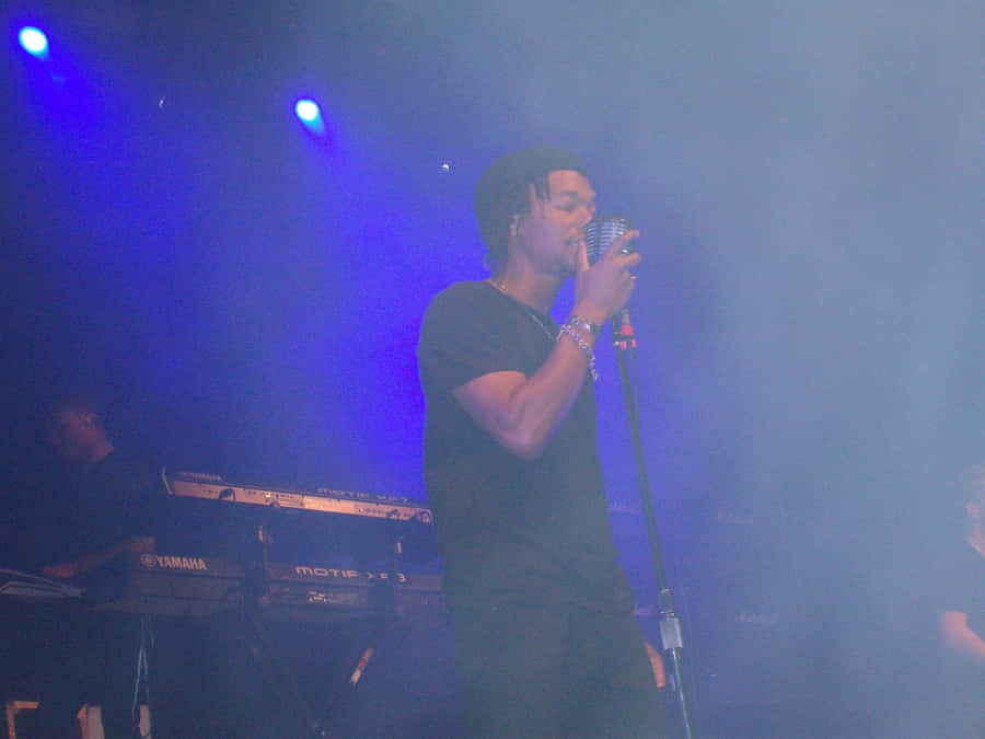 Lupe Fiasco Performing Liveon Stage Wallpaper