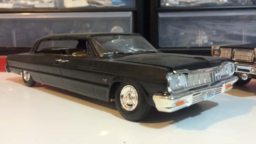 Luxurious Black Sports Car On An Open Road Wallpaper