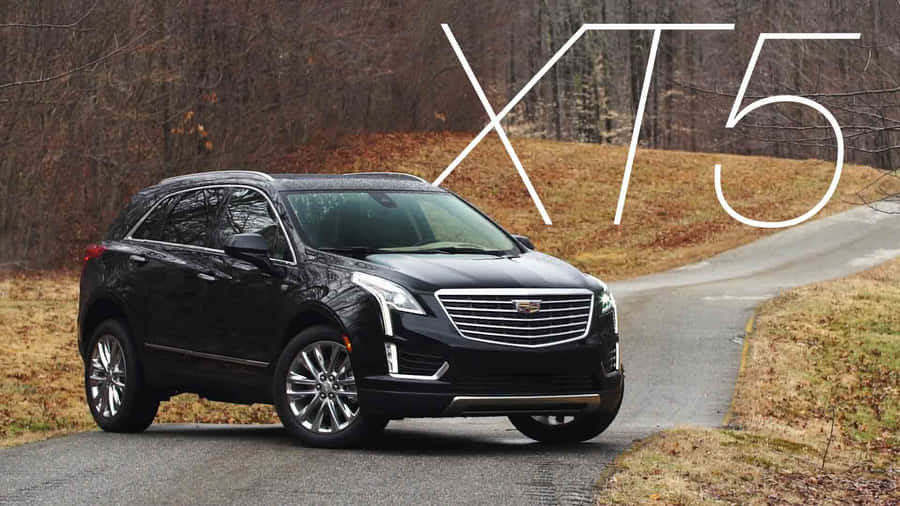 Luxurious Cadillac Xt5 On Scenic Drive Wallpaper