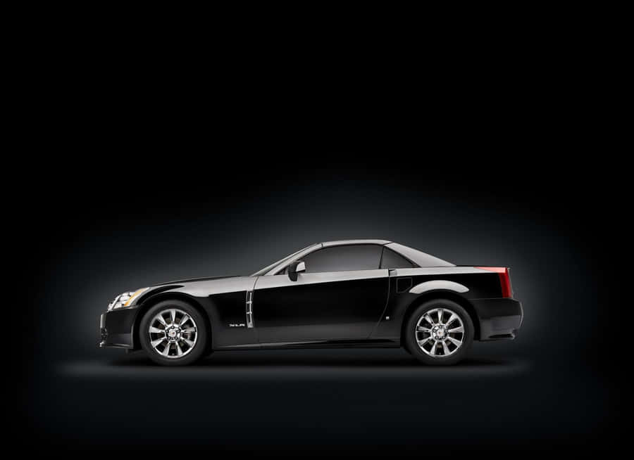 Luxury Cadillac Xlr Sports Car On Display In A Stunning Outdoor Scene. Wallpaper